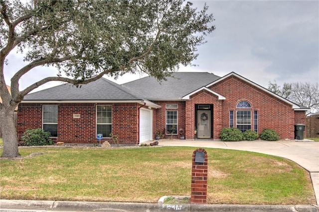 ranch-style house with a garage and a front lawn