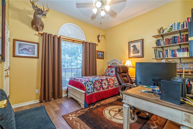 bedroom featuring hardwood / wood-style floors and ceiling fan