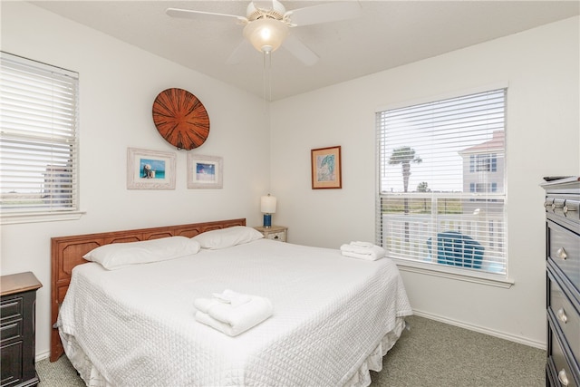 bedroom featuring ceiling fan and light carpet