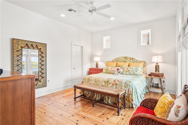 bedroom featuring ceiling fan and light hardwood / wood-style floors