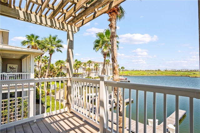 balcony with a pergola and a water view