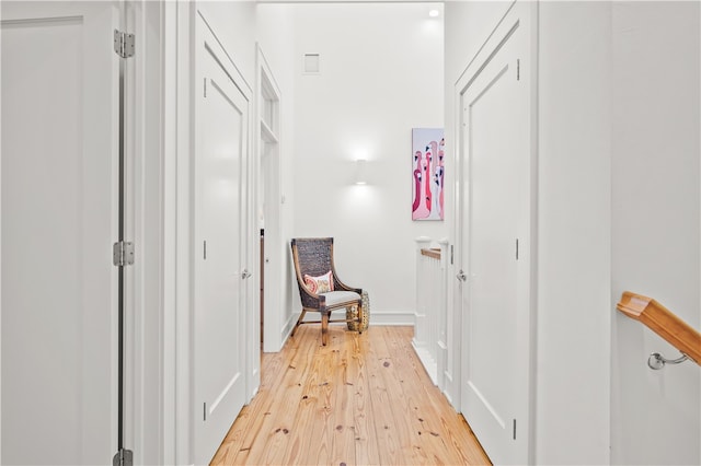 corridor featuring light wood-type flooring