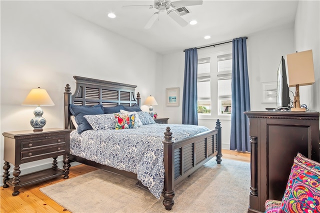 bedroom featuring light hardwood / wood-style floors and ceiling fan