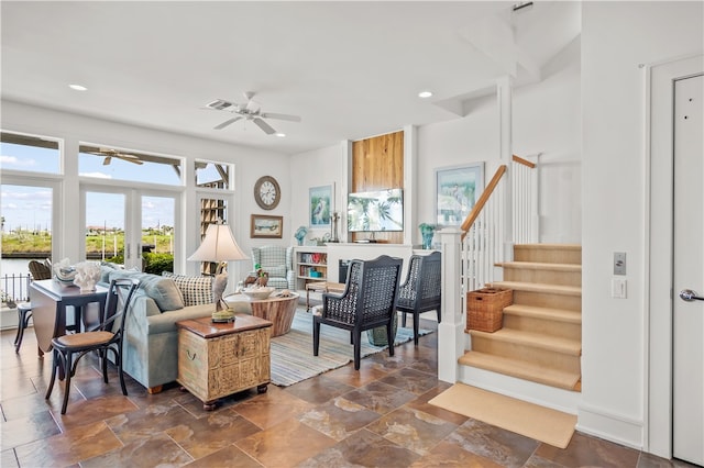 living room with french doors and ceiling fan