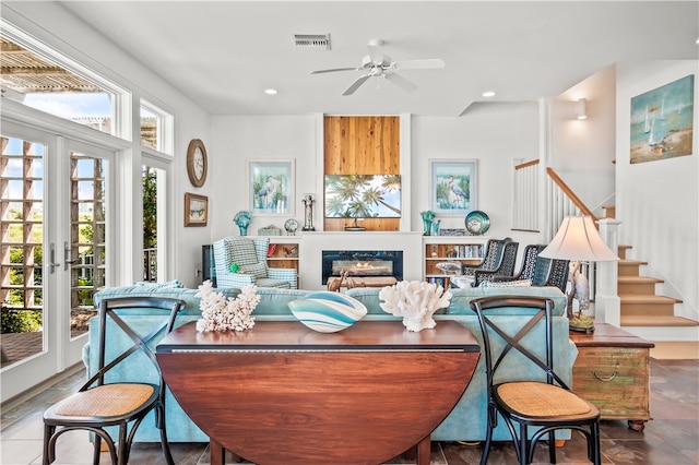 living room with french doors and ceiling fan