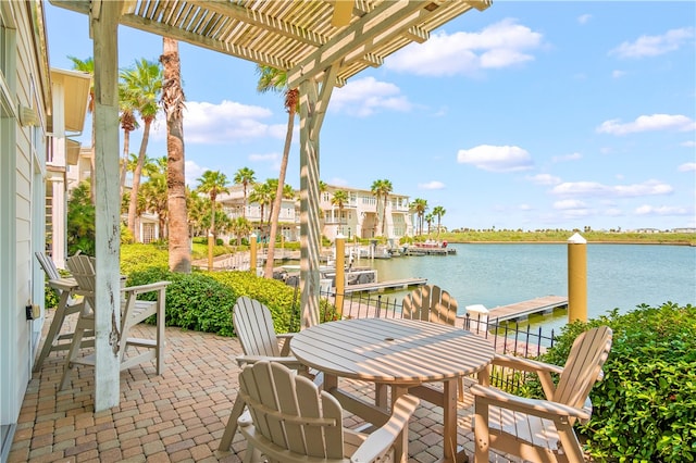 view of patio / terrace with a water view, a pergola, and a boat dock