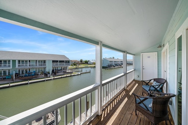 balcony featuring a water view