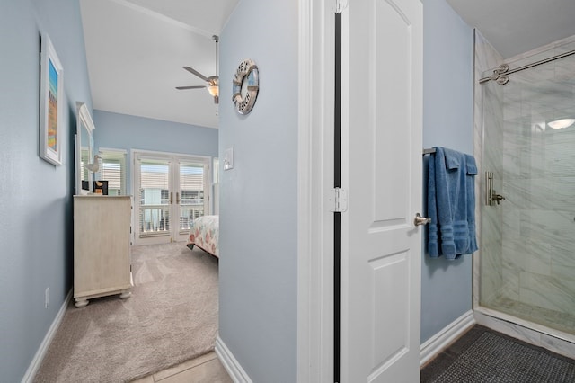 bathroom with ceiling fan and a shower with shower door