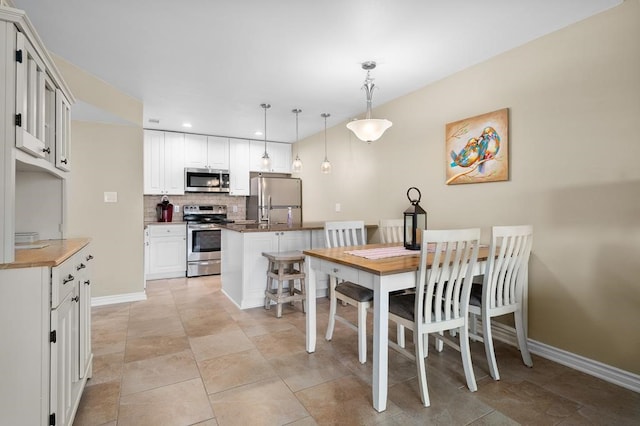 dining area featuring light tile patterned floors