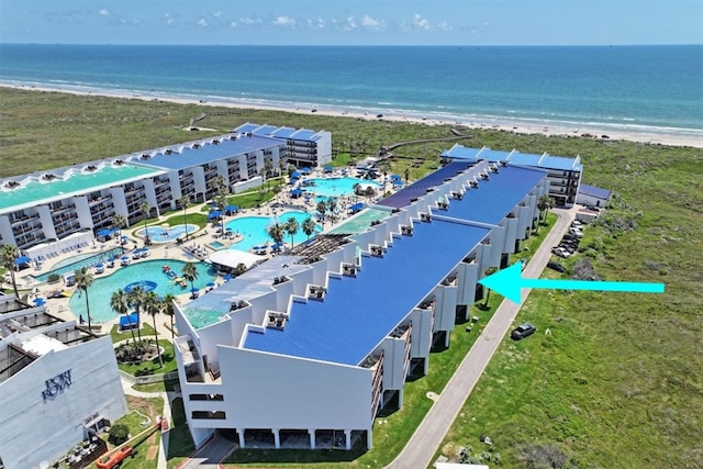 bird's eye view featuring a beach view and a water view