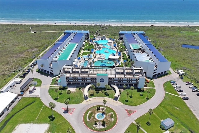 drone / aerial view featuring a view of the beach and a water view