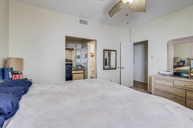 bedroom featuring ceiling fan and connected bathroom