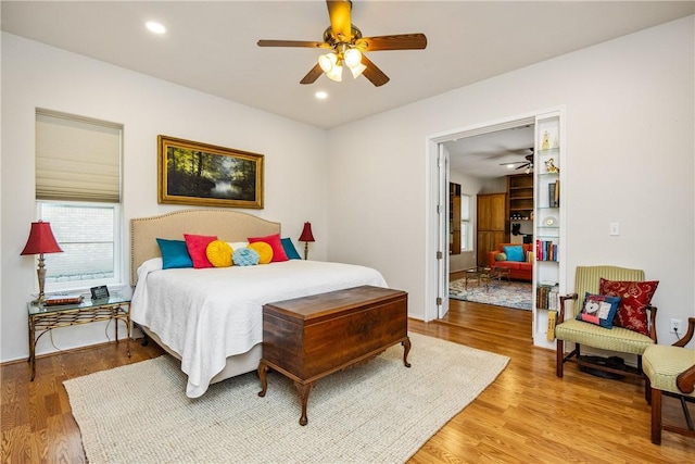 101 Bay Hills Dr, Rockport, TX 78382 - bedroom with light wood finished floors, a ceiling fan, and recessed lighting