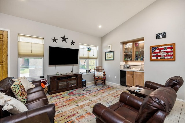 101 Bay Hills Dr, Rockport, TX 78382 - living room with light tile patterned floors, bar, recessed lighting, and high vaulted ceiling