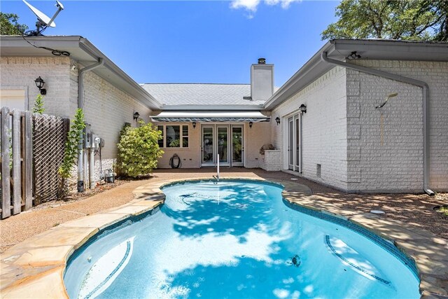 101 Bay Hills Dr, Rockport, TX 78382 - outdoor pool with french doors and a patio area