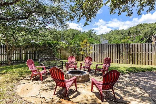 101 Bay Hills Dr, Rockport, TX 78382 - fenced backyard with an outdoor fire pit and a patio area