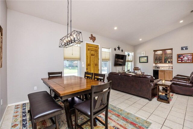 101 Bay Hills Dr, Rockport, TX 78382 - dining room featuring vaulted ceiling, light tile patterned floors, and recessed lighting