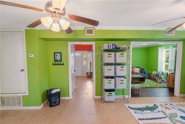 101 Llano Dr, Portland, TX 78374 - interior space featuring a ceiling fan, tile patterned floors, crown molding, and baseboards
