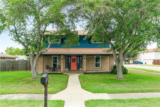 101 Llano Dr, Portland, TX 78374 - view of front facade with covered porch and brick siding