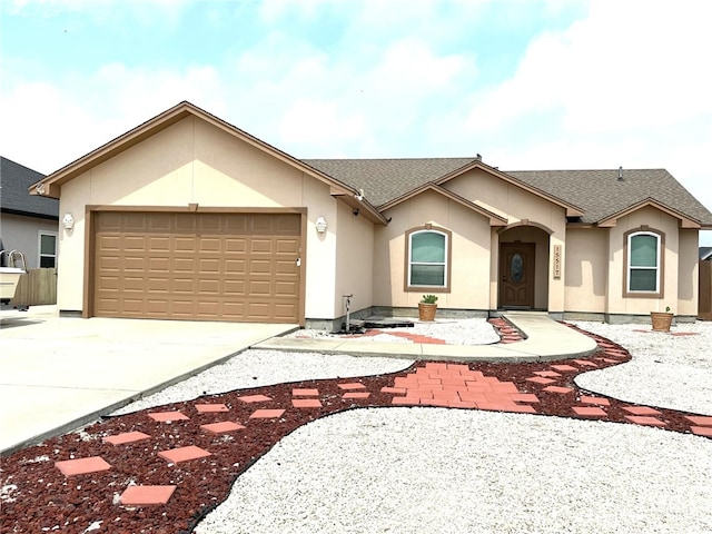 15517 Dyna St, Corpus Christi, TX 78418 - single story home featuring concrete driveway, an attached garage, roof with shingles, and stucco siding
