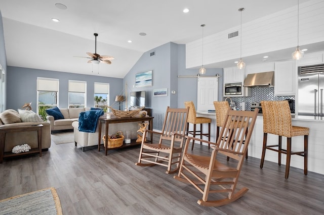 1819 Bay Shore Dr, Rockport, TX 78382 - living room featuring a ceiling fan, wood finished floors, recessed lighting, and high vaulted ceiling