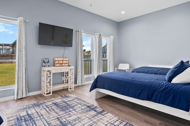1819 Bay Shore Dr, Rockport, TX 78382 - bedroom featuring wood finished floors, baseboards, and recessed lighting