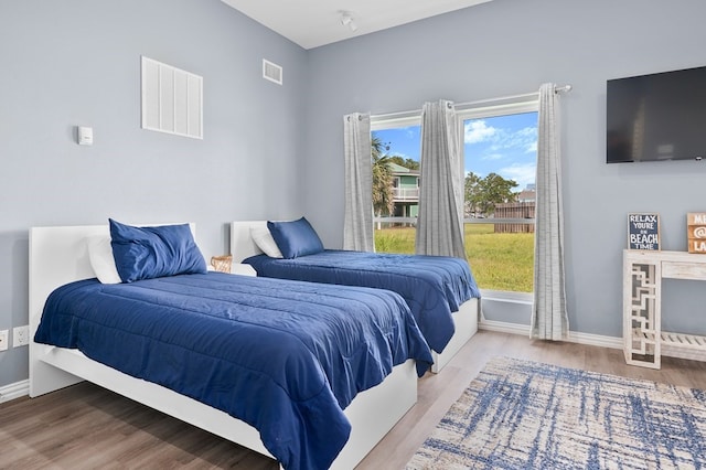 1819 Bay Shore Dr, Rockport, TX 78382 - bedroom featuring wood finished floors and baseboards