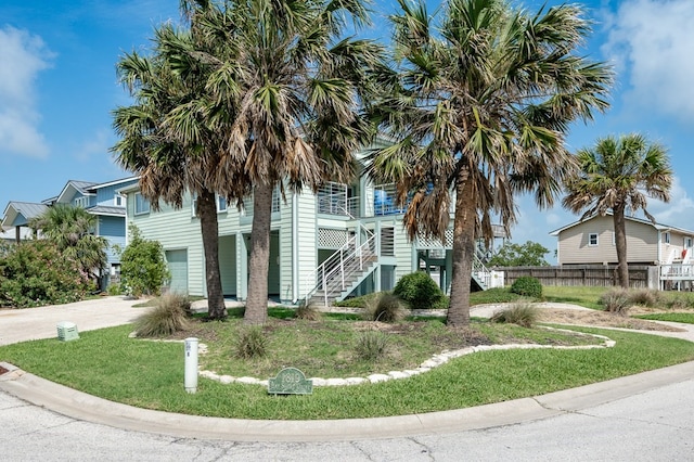 1819 Bay Shore Dr, Rockport, TX 78382 - view of side of home featuring stairs and driveway