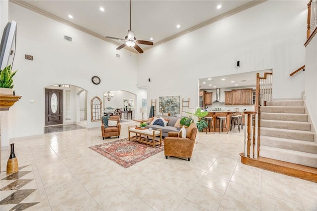 46 E Bar Le Doc Dr, Corpus Christi, TX 78414 - living room with arched walkways, ceiling fan, crown molding, recessed lighting, and a high ceiling