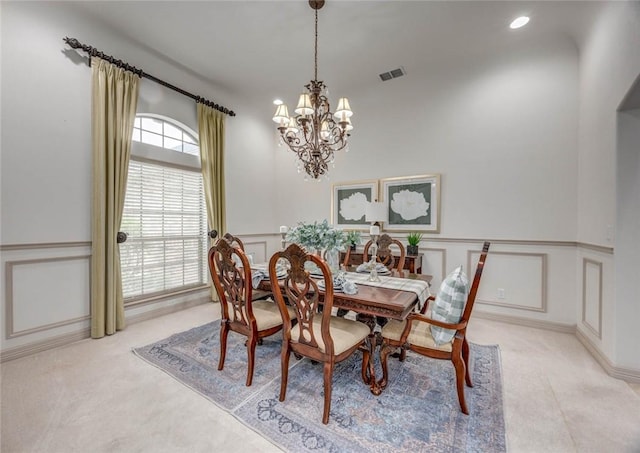 46 E Bar Le Doc Dr, Corpus Christi, TX 78414 - dining room with a chandelier, a decorative wall, a wainscoted wall, and recessed lighting