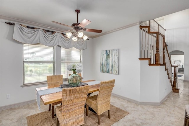 46 E Bar Le Doc Dr, Corpus Christi, TX 78414 - dining room featuring a ceiling fan, healthy amount of natural light, stairs, arched walkways, and ornamental molding
