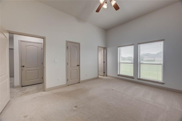46 E Bar Le Doc Dr, Corpus Christi, TX 78414 - unfurnished bedroom with carpet flooring, baseboards, high vaulted ceiling, and a ceiling fan