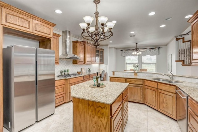 46 E Bar Le Doc Dr, Corpus Christi, TX 78414 - kitchen with stainless steel appliances, wall chimney range hood, a chandelier, light tile patterned floors, and a sink