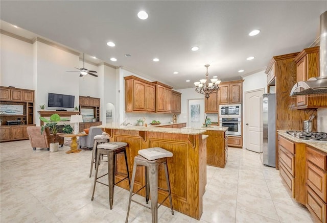 46 E Bar Le Doc Dr, Corpus Christi, TX 78414 - kitchen featuring appliances with stainless steel finishes, crown molding, a peninsula, a chandelier, and recessed lighting
