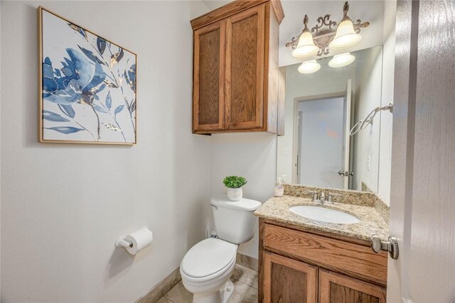 46 E Bar Le Doc Dr, Corpus Christi, TX 78414 - bathroom with toilet, baseboards, vanity, and tile patterned flooring