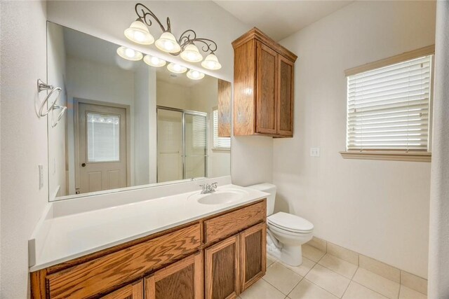 46 E Bar Le Doc Dr, Corpus Christi, TX 78414 - full bathroom featuring a shower stall, tile patterned floors, toilet, and vanity