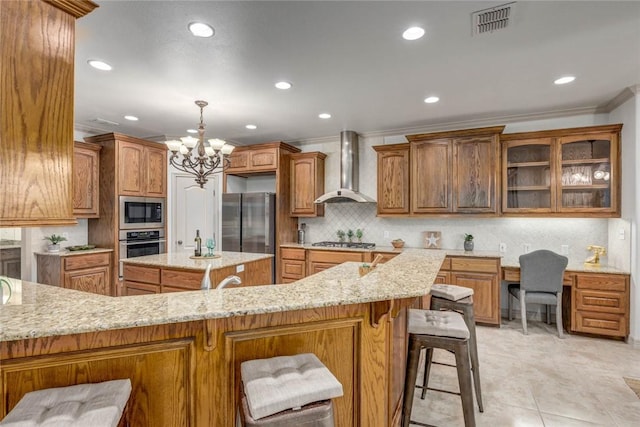 46 E Bar Le Doc Dr, Corpus Christi, TX 78414 - kitchen featuring wall chimney exhaust hood, appliances with stainless steel finishes, ornamental molding, recessed lighting, and a chandelier