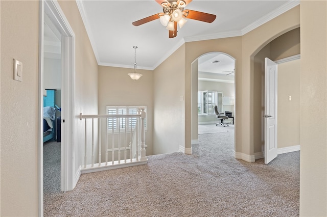 hall with light carpet and ornamental molding