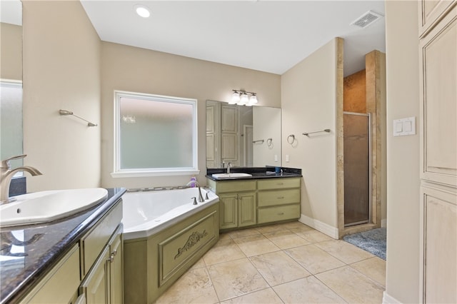 bathroom featuring vanity and shower with separate bathtub