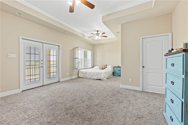 bedroom with access to exterior, carpet flooring, french doors, and a tray ceiling