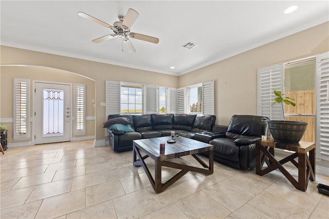 living room featuring ceiling fan and ornamental molding