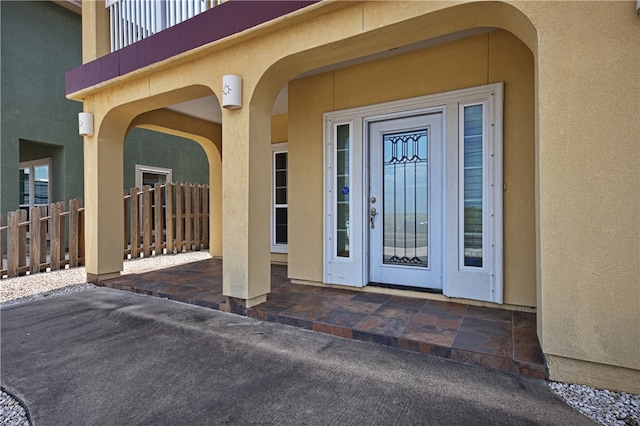 entrance to property with a balcony