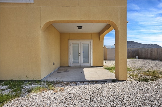 property entrance featuring a patio area