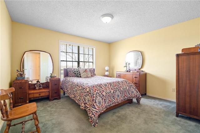 carpeted bedroom with a textured ceiling and baseboards