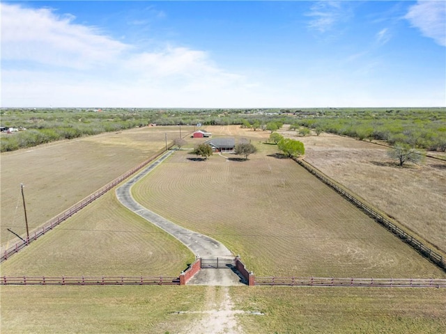 birds eye view of property with a rural view