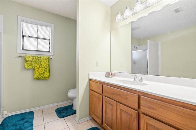 bathroom featuring tile patterned floors, visible vents, toilet, a stall shower, and vanity