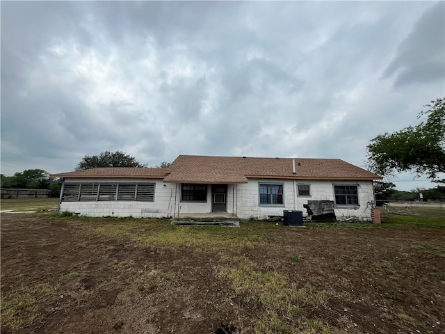 rear view of property featuring cooling unit