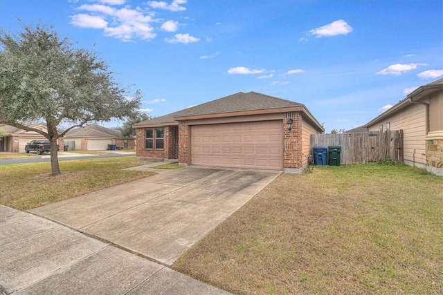 ranch-style home with a garage and a front yard