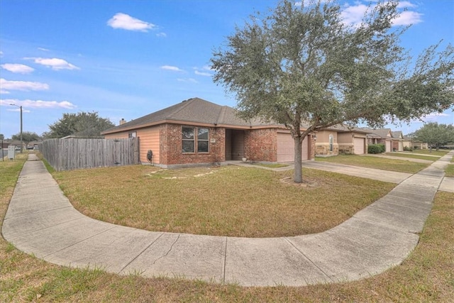 ranch-style house featuring a garage and a front yard