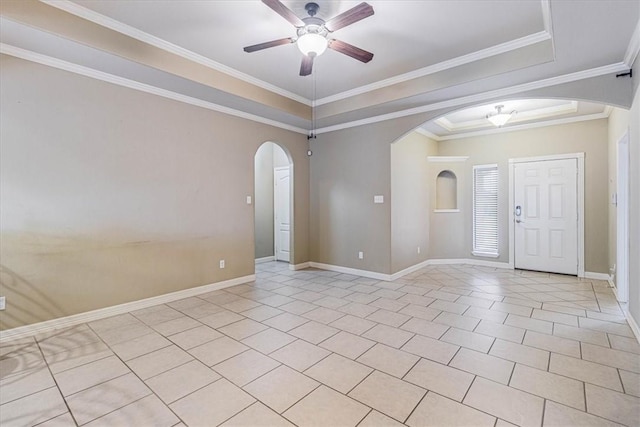 spare room featuring crown molding, ceiling fan, a raised ceiling, and light tile patterned flooring